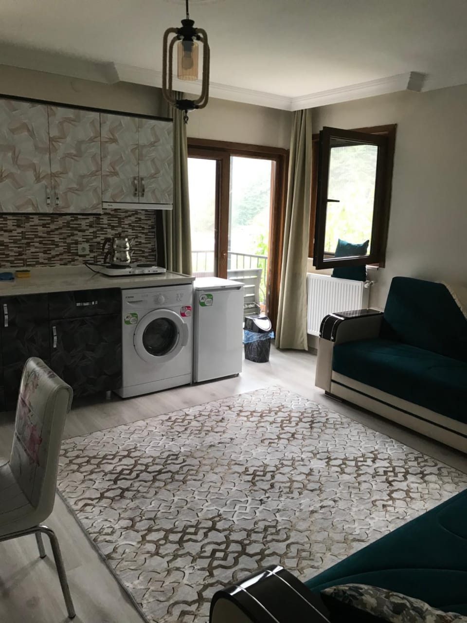 Kitchen or kitchenette, Seating area, stove, washing machine