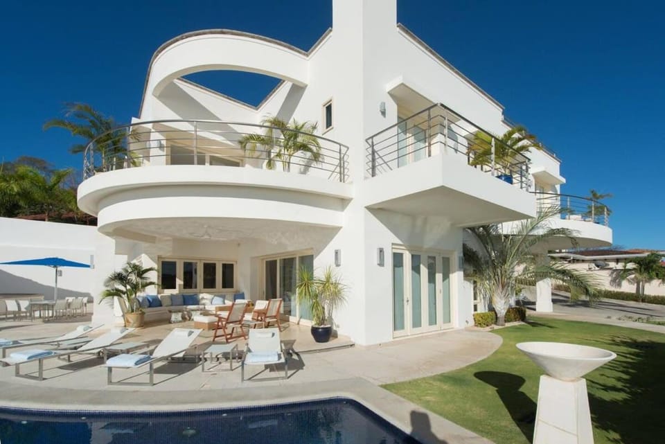 Exquisite Hilltop Villa with Luxurious Modern Design, Sweeping Ocean Views & Sparkling Infinity Pool House in Playa Flamingo