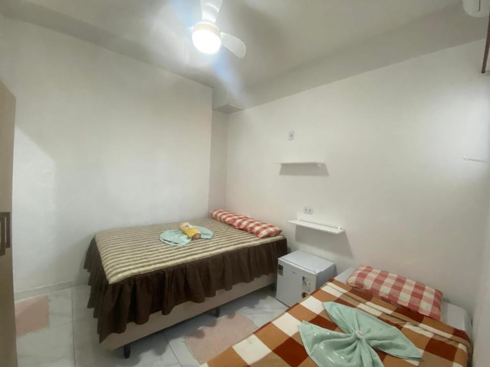 Photo of the whole room, minibar, towels, air conditioner