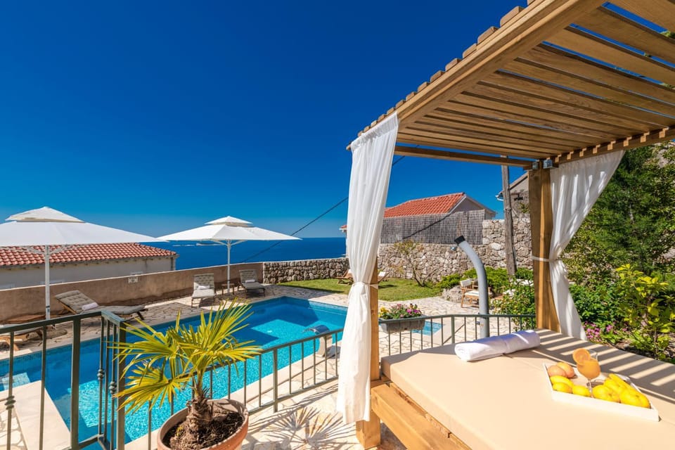 Property building, Patio, Day, Natural landscape, View (from property/room), Balcony/Terrace, Pool view, Sea view, Swimming pool, sunbed