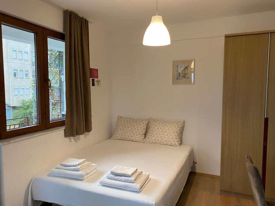 Bed, towels, wardrobe