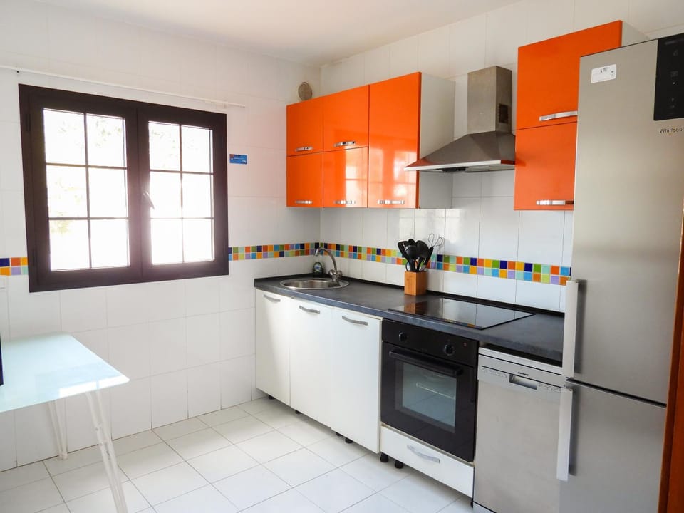 Kitchen or kitchenette, dishwasher, oven, stove