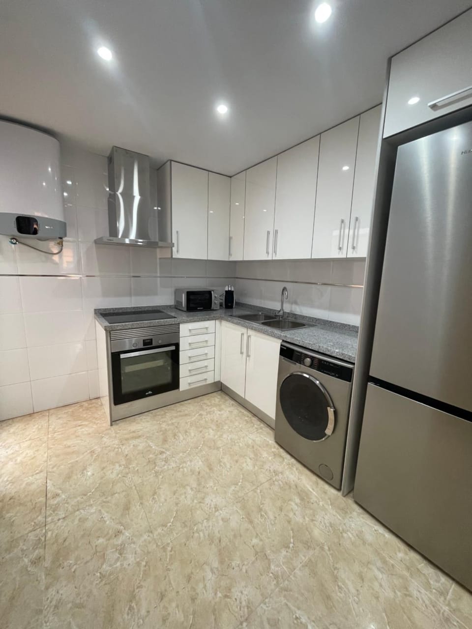 Kitchen or kitchenette, oven, stove, toaster, washing machine