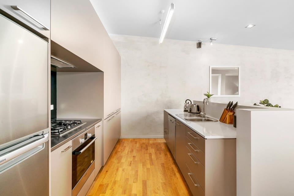 Kitchen or kitchenette, dishwasher, oven, stove, toaster