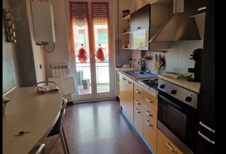 Kitchen or kitchenette, dishwasher, oven, stove