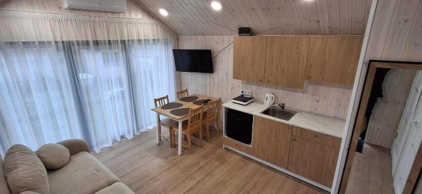 Kitchen or kitchenette, Living room, Seating area, Dining area