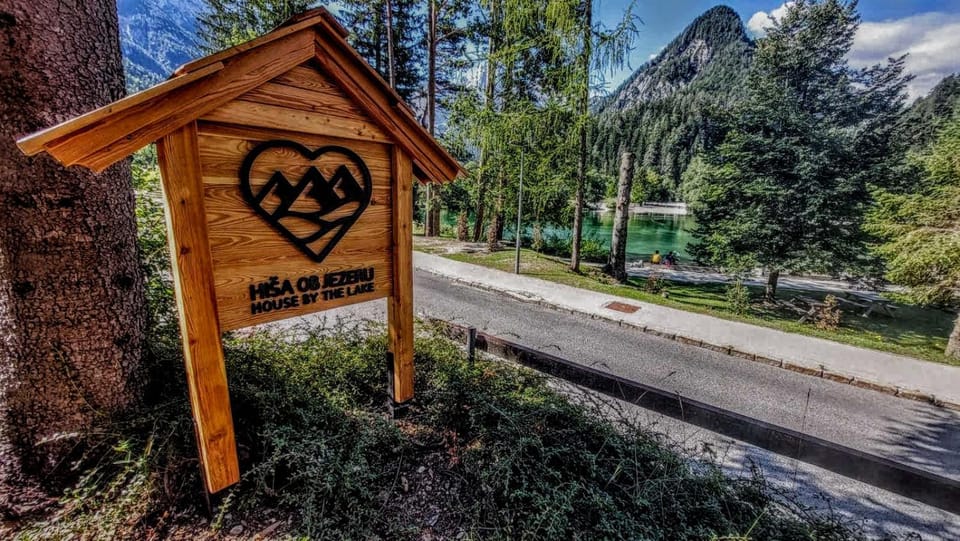 Property logo or sign, Natural landscape, Text overlay, Mountain view