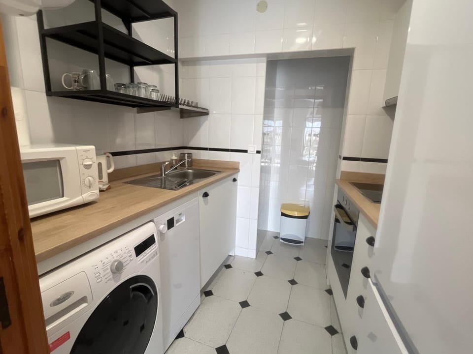 Kitchen or kitchenette, washing machine
