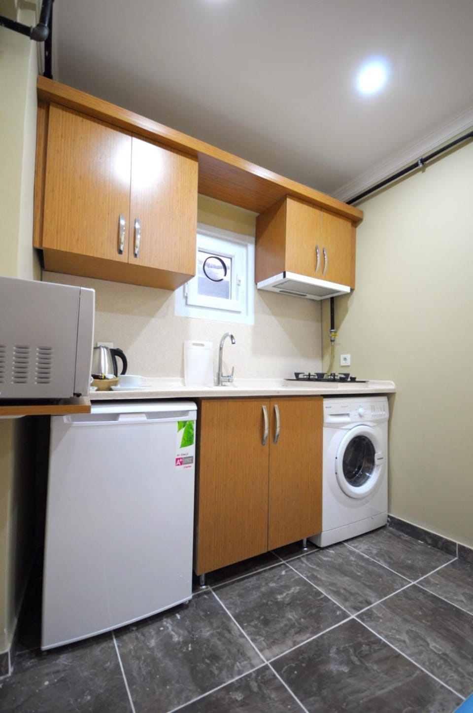 Kitchen or kitchenette, stove, washing machine
