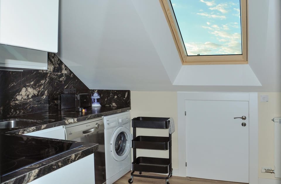 Kitchen or kitchenette, dishwasher, stove, washing machine