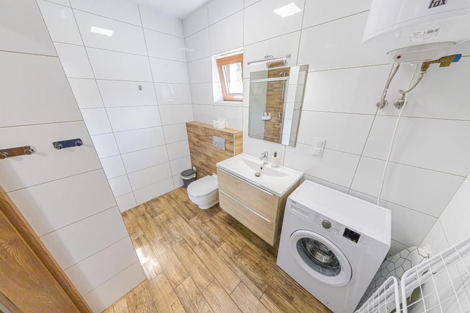 Shower, Toilet, Bathroom, towels, washing machine, dryer