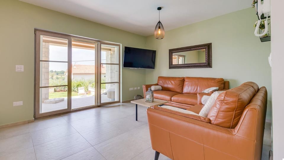 Property building, Living room, Seating area, air conditioner