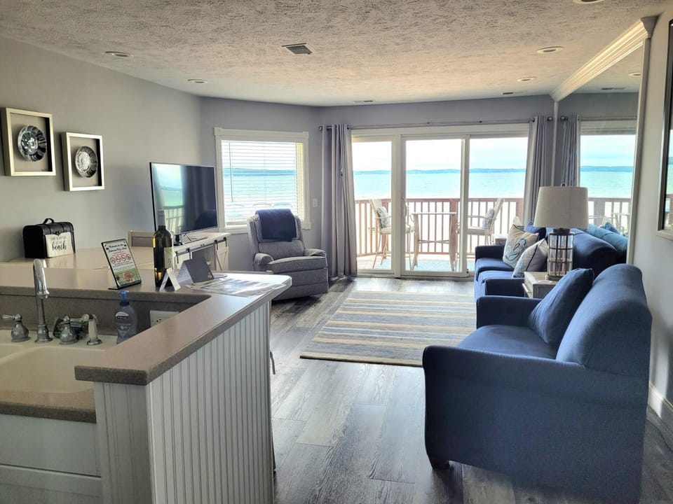 Beachside 213 with Pool Hot Tub and Private Deck overlooking East Bay House in Michigan
