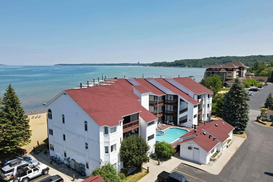Beachside 213 with Pool Hot Tub and Private Deck overlooking East Bay House in Michigan
