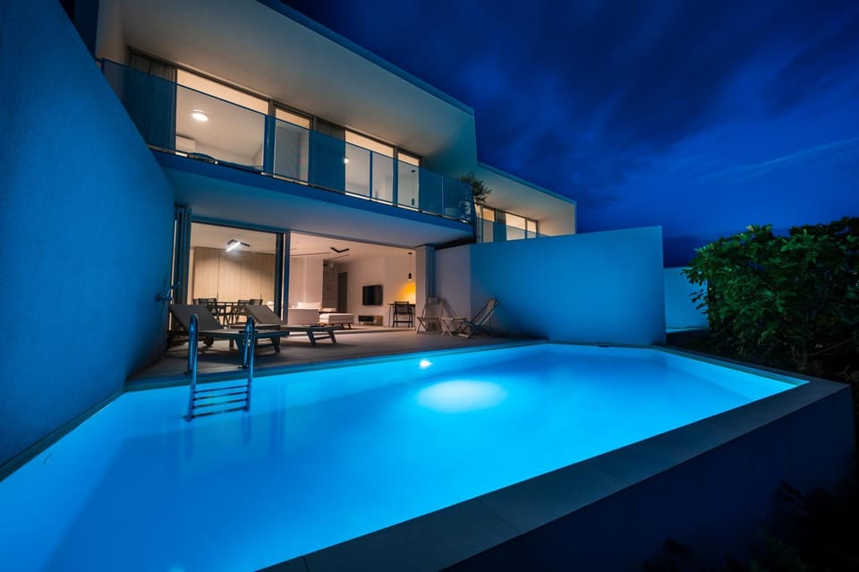 Property building, Patio, Night, Pool view, Swimming pool