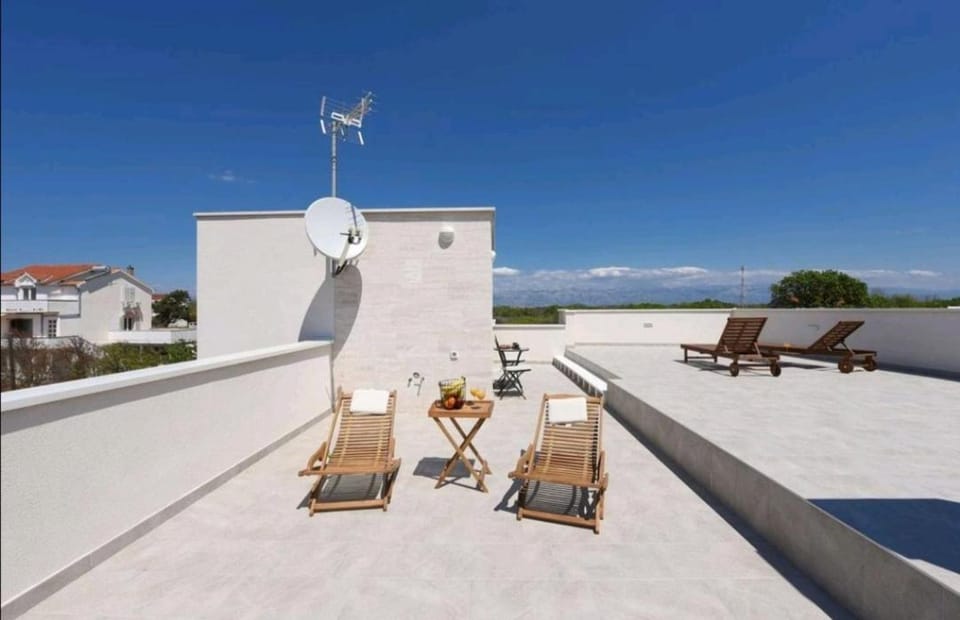 Casa Bianca family apartment near sandy beach with parking and rooftop experience Apartment in Zadar County