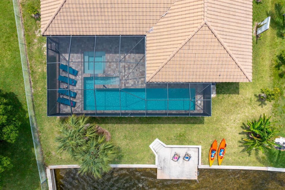 Custom Heated Pool, Kayaks, Bikes, & Spectacular Views - Villa Lakeside Oasis - Roelens Vacations House in Cape Coral