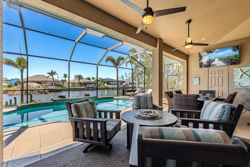 Villa Neptune's Grotto- BRAND NEW with heated Pool, Hot Tub, and dock with Tiki House in Cape Coral