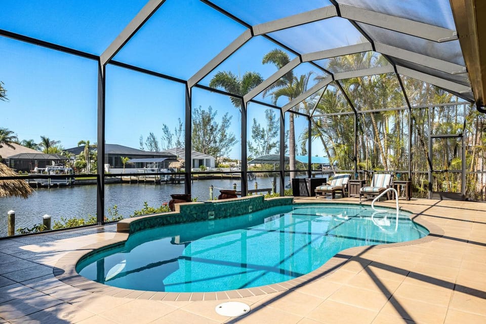 Villa Neptune's Grotto- BRAND NEW with heated Pool, Hot Tub, and dock with Tiki House in Cape Coral