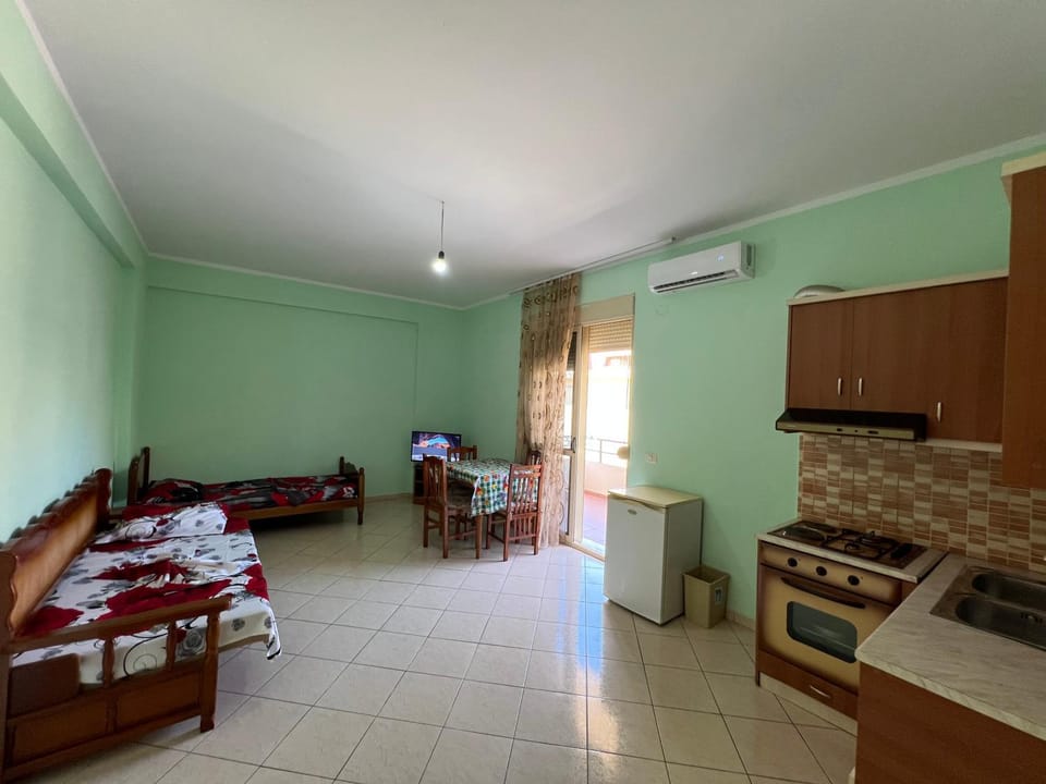 Kitchen or kitchenette, Living room, Seating area, Dining area, oven, stove, air conditioner