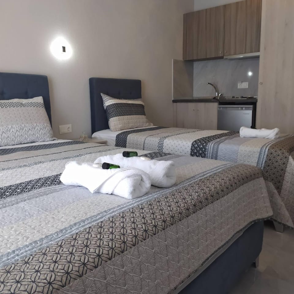 Bed, Photo of the whole room, Bedroom, stove, towels, kitchen