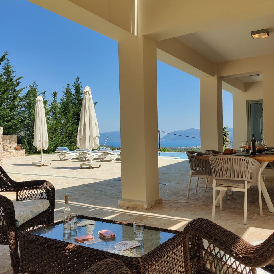 Patio, Day, Natural landscape, View (from property/room), Balcony/Terrace, Living room, Seating area, Dining area, Lake view, Mountain view, Pool view, Sea view, sunbed