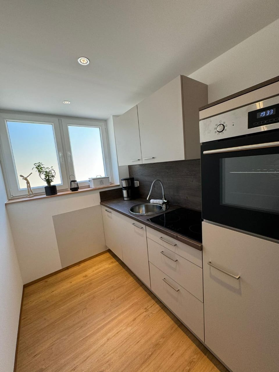 Kitchen or kitchenette, dishwasher, stove, toaster