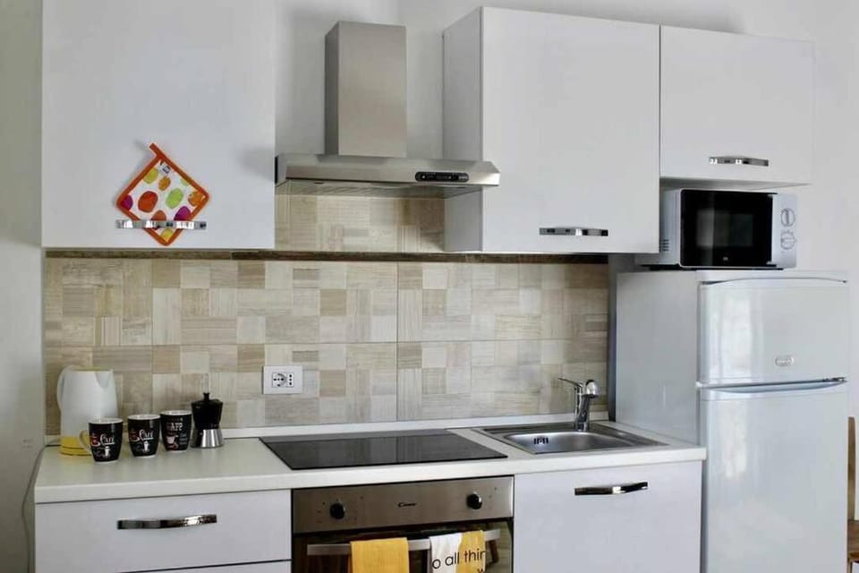 Kitchen or kitchenette, dishwasher, oven, stove