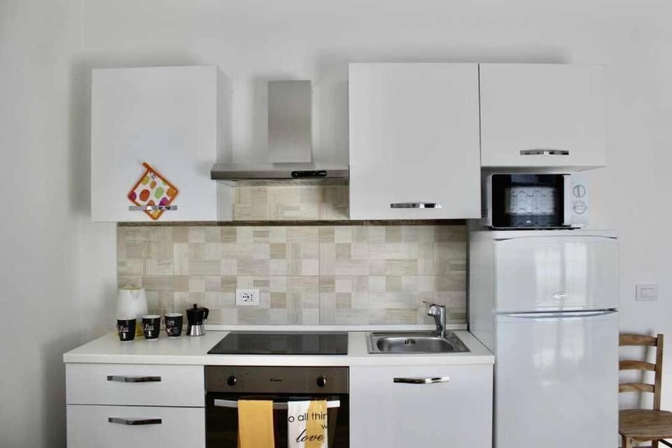 Kitchen or kitchenette, oven, stove