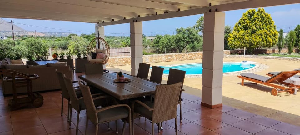 Patio, Seating area, Dining area, Pool view, Swimming pool