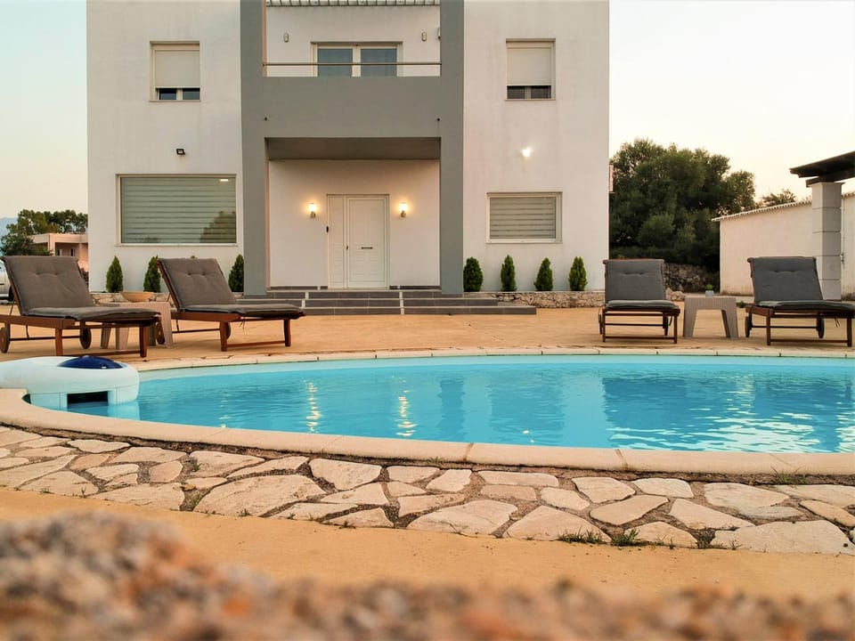 Property building, Patio, Pool view, Swimming pool, sunbed