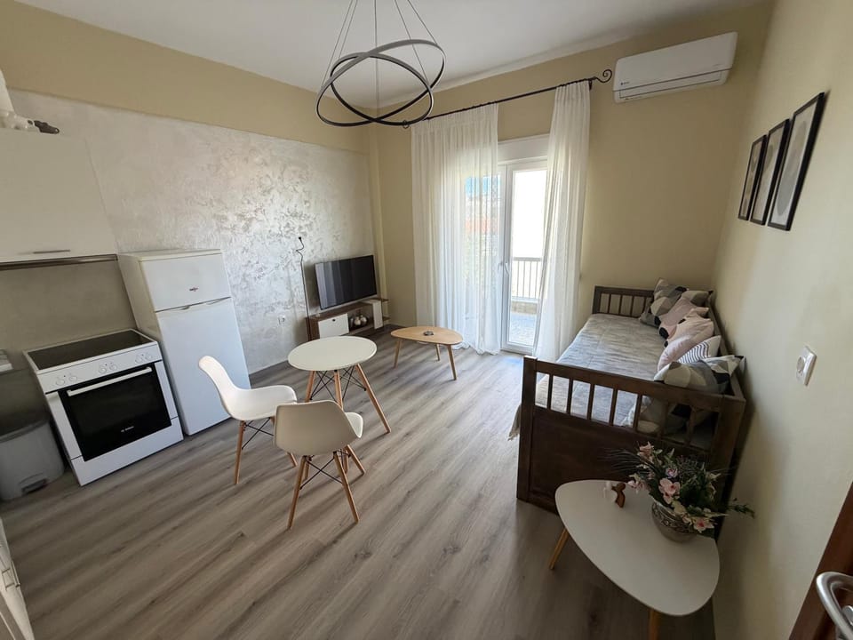 TV and multimedia, Kitchen or kitchenette, Living room, Seating area, Dining area, oven, stove, air conditioner