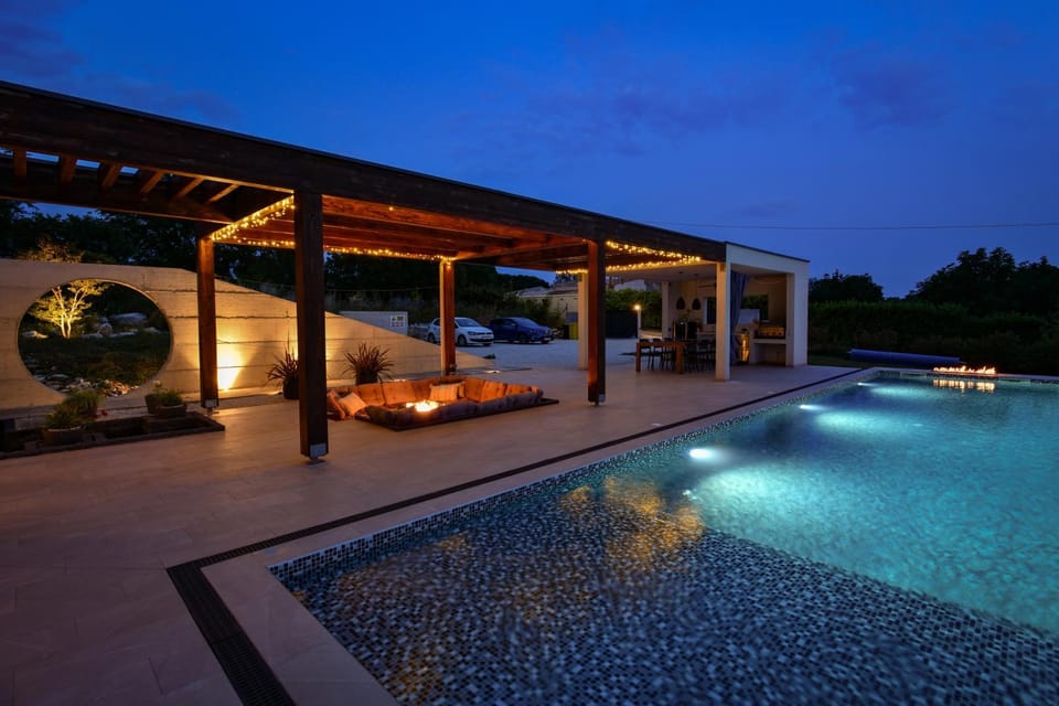 Property building, Night, Seating area, Pool view, Swimming pool