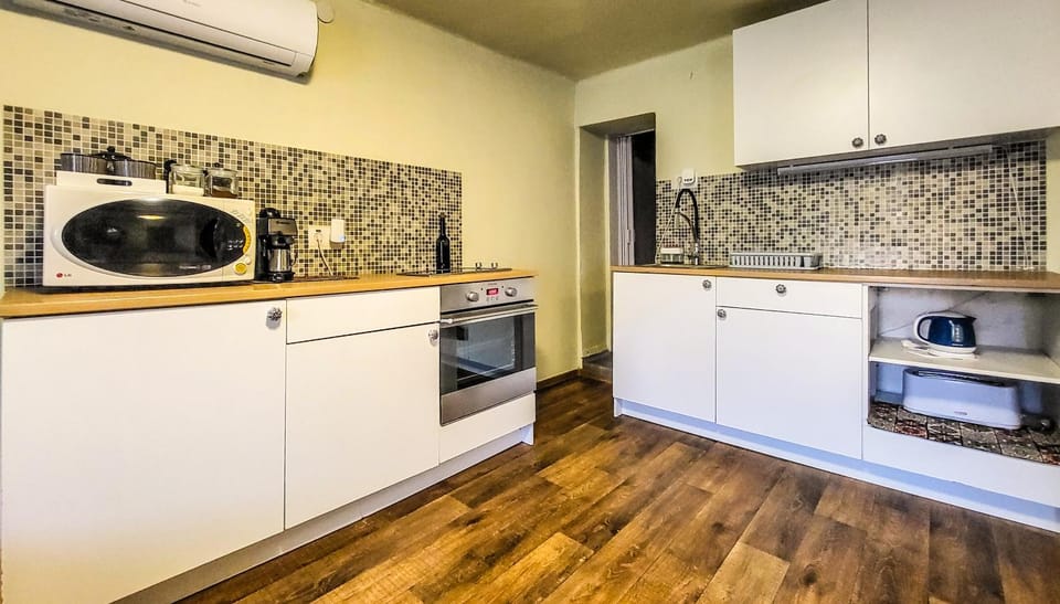 Kitchen or kitchenette, oven, stove, toaster