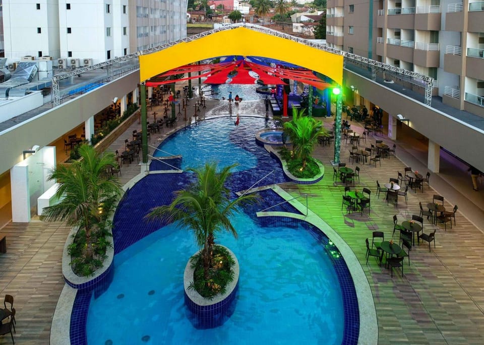 Hospedagem ao lado Thermas dos Laranjais no Enjoy Olímpia Park Resort para famílias Apartment in Olímpia