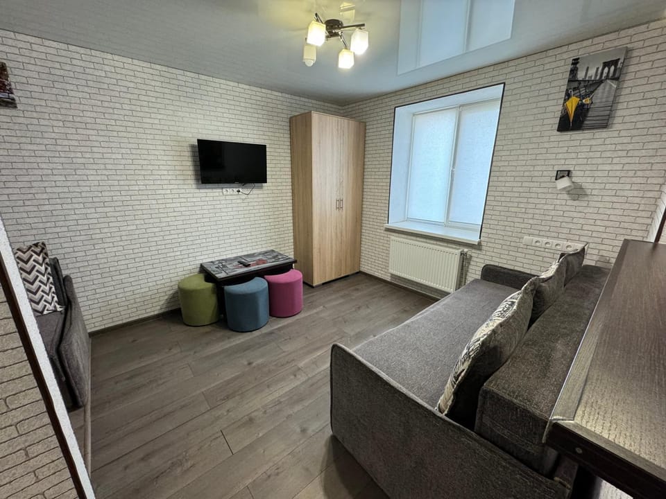 Bed, TV and multimedia, Seating area, wardrobe