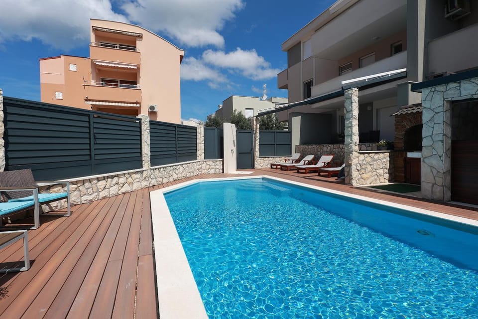 Property building, Patio, Day, View (from property/room), Pool view, Swimming pool, sunbed