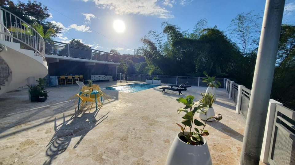 Property building, Patio, Pool view, Swimming pool, sunbed