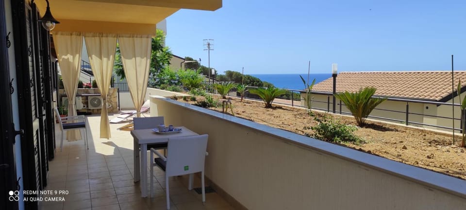 Property building, Patio, Natural landscape, View (from property/room), Balcony/Terrace, Dining area, Sea view