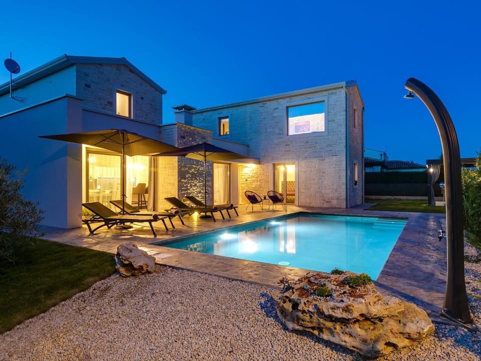 Property building, Patio, Night, Swimming pool, sunbed