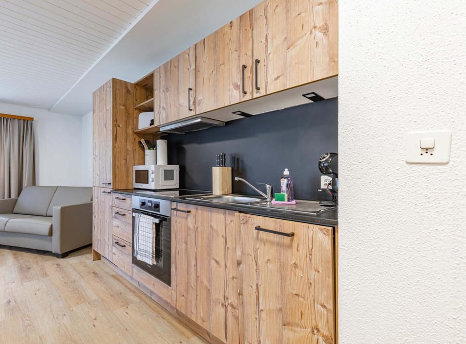 Kitchen or kitchenette, Living room, Seating area, stove