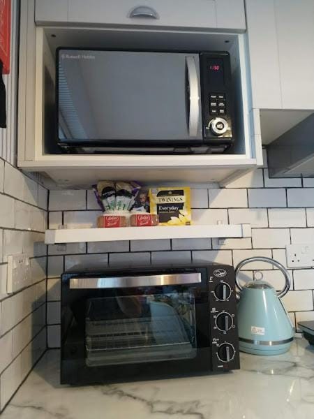 Kitchen or kitchenette, stove