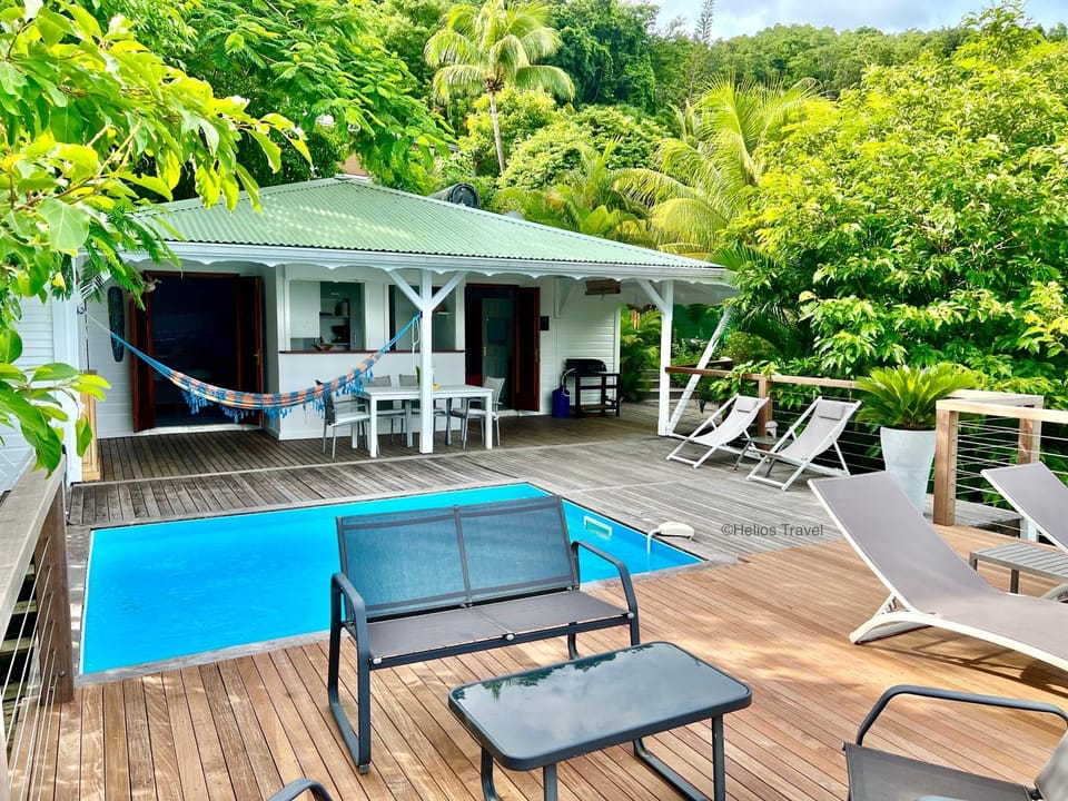 Property building, Patio, Day, Natural landscape, Garden, Balcony/Terrace, Dining area, Garden view, Pool view, Sea view, Swimming pool, sunbed