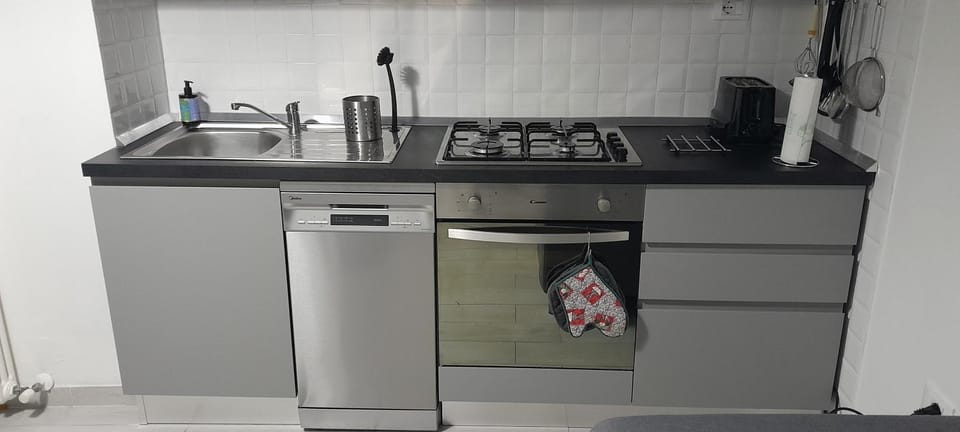 Kitchen or kitchenette, dishwasher, oven, stove