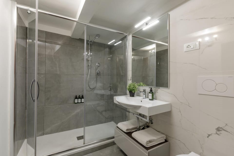 Shower, Toilet, Bathroom, hair dryier, towels, towels