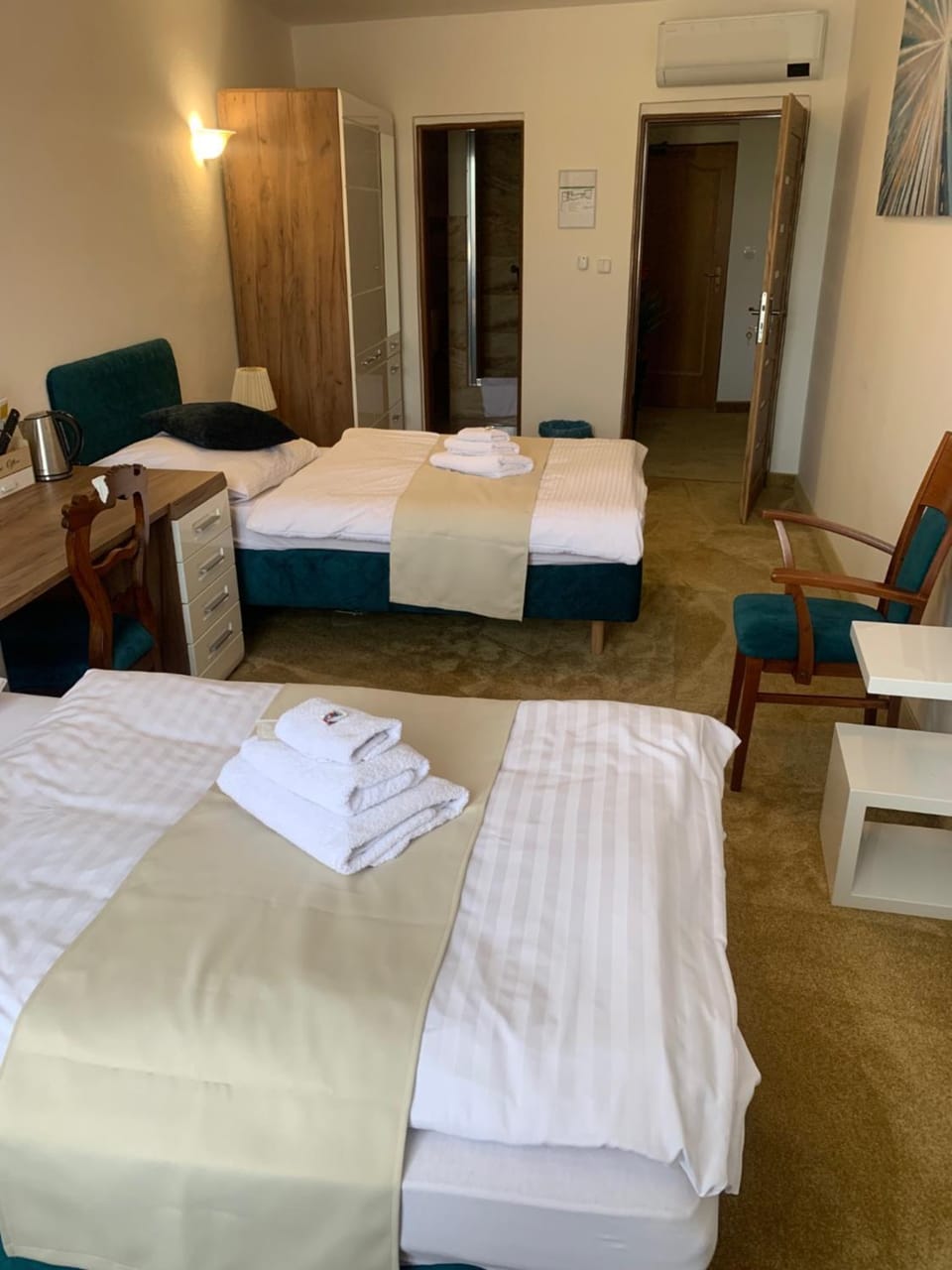 Photo of the whole room, Bedroom, hair dresser, towels