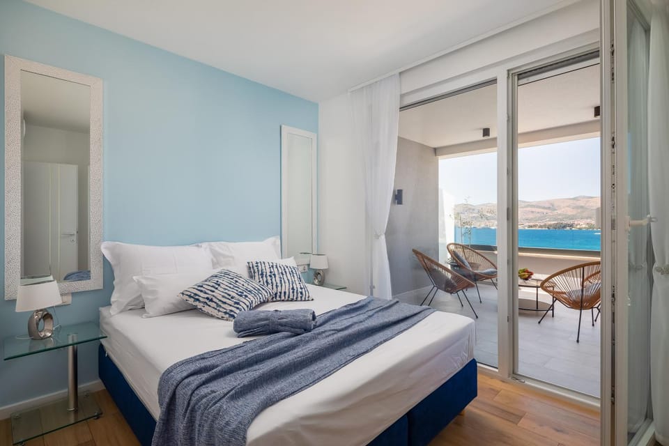 Property building, Nearby landmark, Bed, Natural landscape, View (from property/room), View (from property/room), Balcony/Terrace, Living room, Photo of the whole room, Seating area, Beach, Windsurfing, Windsurfing, Bedroom, Text overlay, City view, Mountain view, Pool view, Sea view, Sea view, Sunrise, Sunset, Open Air Bath, Open Air Bath, towels, towels