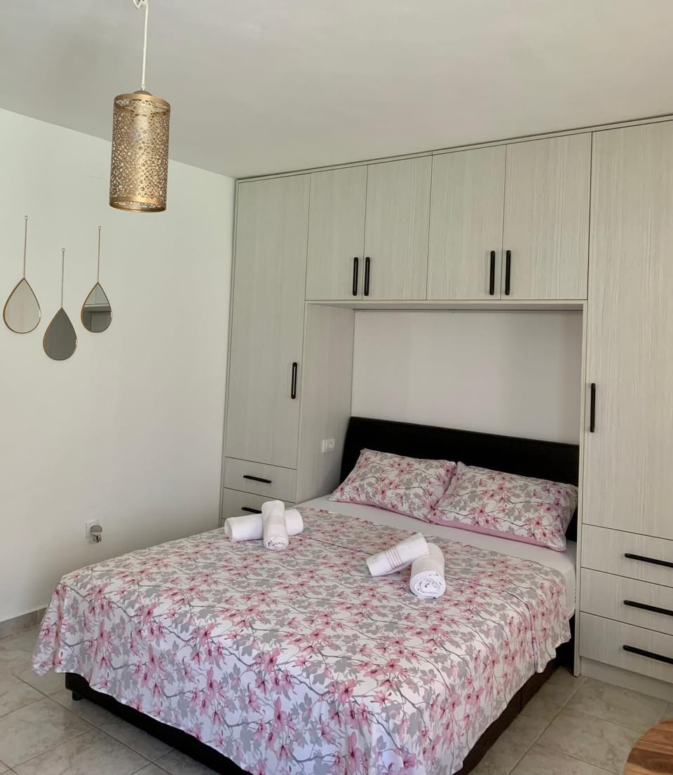Bed, towels, wardrobe