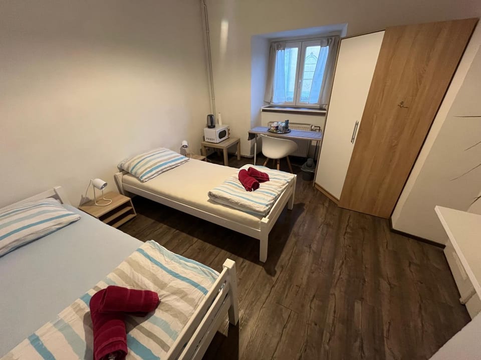 Bed, towels, wardrobe
