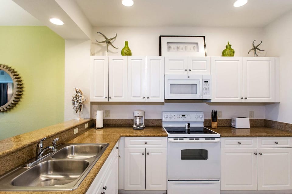 Kitchen or kitchenette, dishwasher, oven, stove, toaster